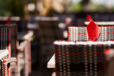 Red tissue paper on table at sidewalk cafe