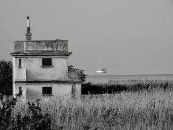 Building on land against clear sky