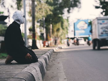 Side view of woman on street