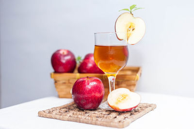 Close-up of apple and fruits on table