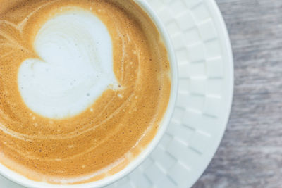 Close-up of coffee cup on table