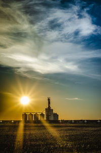 Scenic view of field against sky during sunset