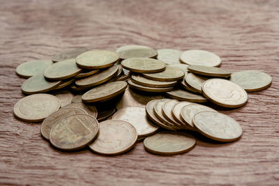 Close-up of coins on table