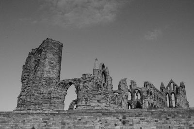 Low angle view of old ruin building against sky