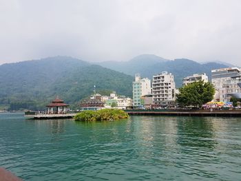 View of river with buildings in background