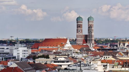 Buildings in town against sky