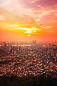 High angle view of city at sunset