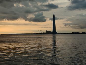 Scenic view of sea against cloudy sky