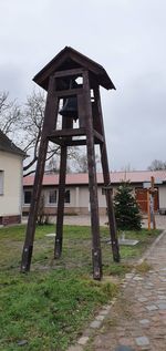 Built structure on field against sky