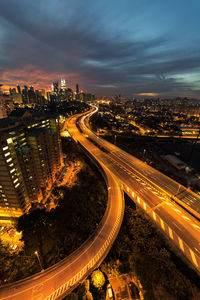 High angle view of illuminated city street at night