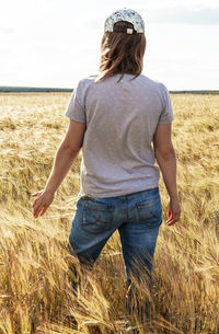 Rear view of man standing on beach