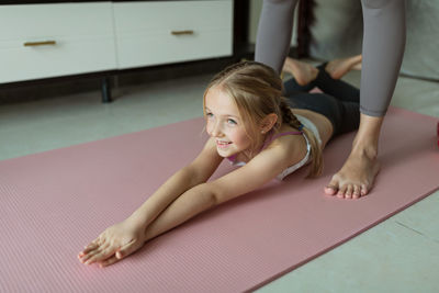 Portrait of girl sitting on floor