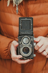 Close-up of hand holding camera