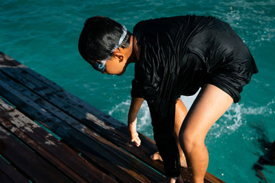 High angle view of boy swimming in pool