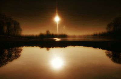 Scenic view of lake at sunset