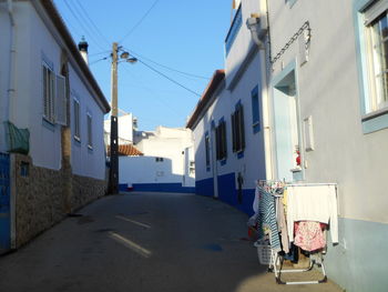 Road amidst buildings in city