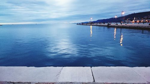 Scenic view of sea against cloudy sky