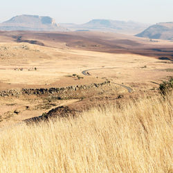 Scenic view of landscape and mountains against sky