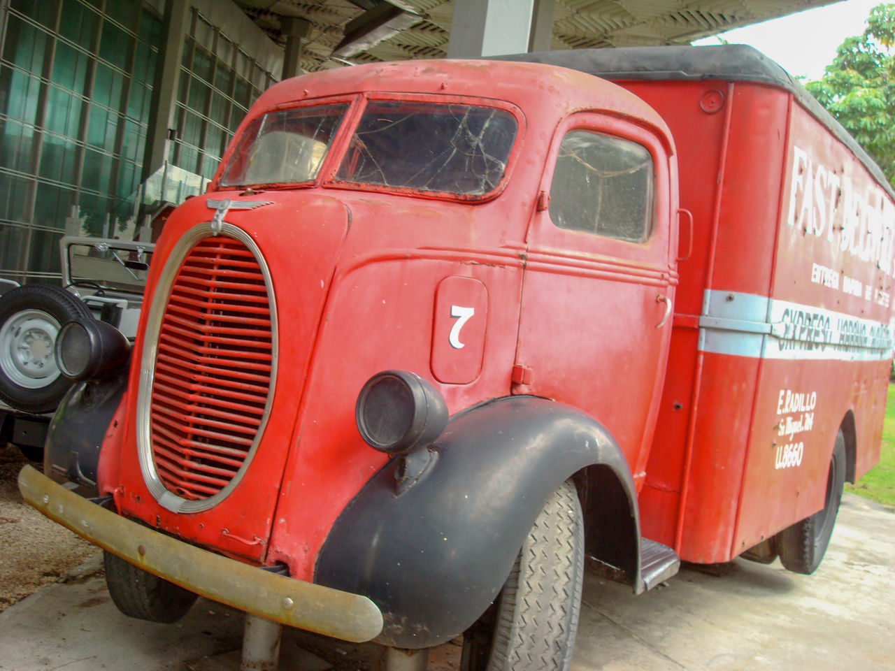 CLOSE-UP OF ABANDONED CAR IN PARK