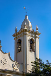 Low angle view of building against blue sky