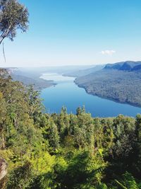 Scenic view of lake against blue sky