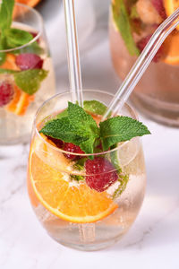 Summer sangria cocktail or lemonade with raspberry, orange and mint. organic detox healthy drink 