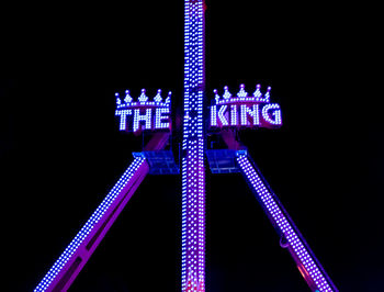 Low angle view of metallic structure against sky at night