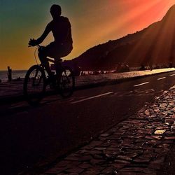 People on road at sunset