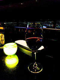 Close-up of wine glasses on table