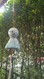 Close-up of toy hanging on tree