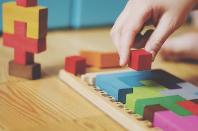 Boy playing with toy on table