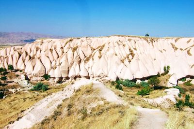 Scenic view of desert against clear sky