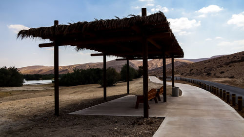 Built structure on beach against sky