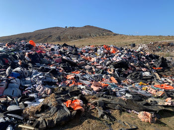High angle view of garbage by mountain against clear sky