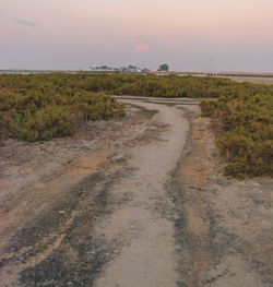 Road on field against sky