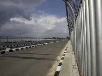 View of bridge against cloudy sky