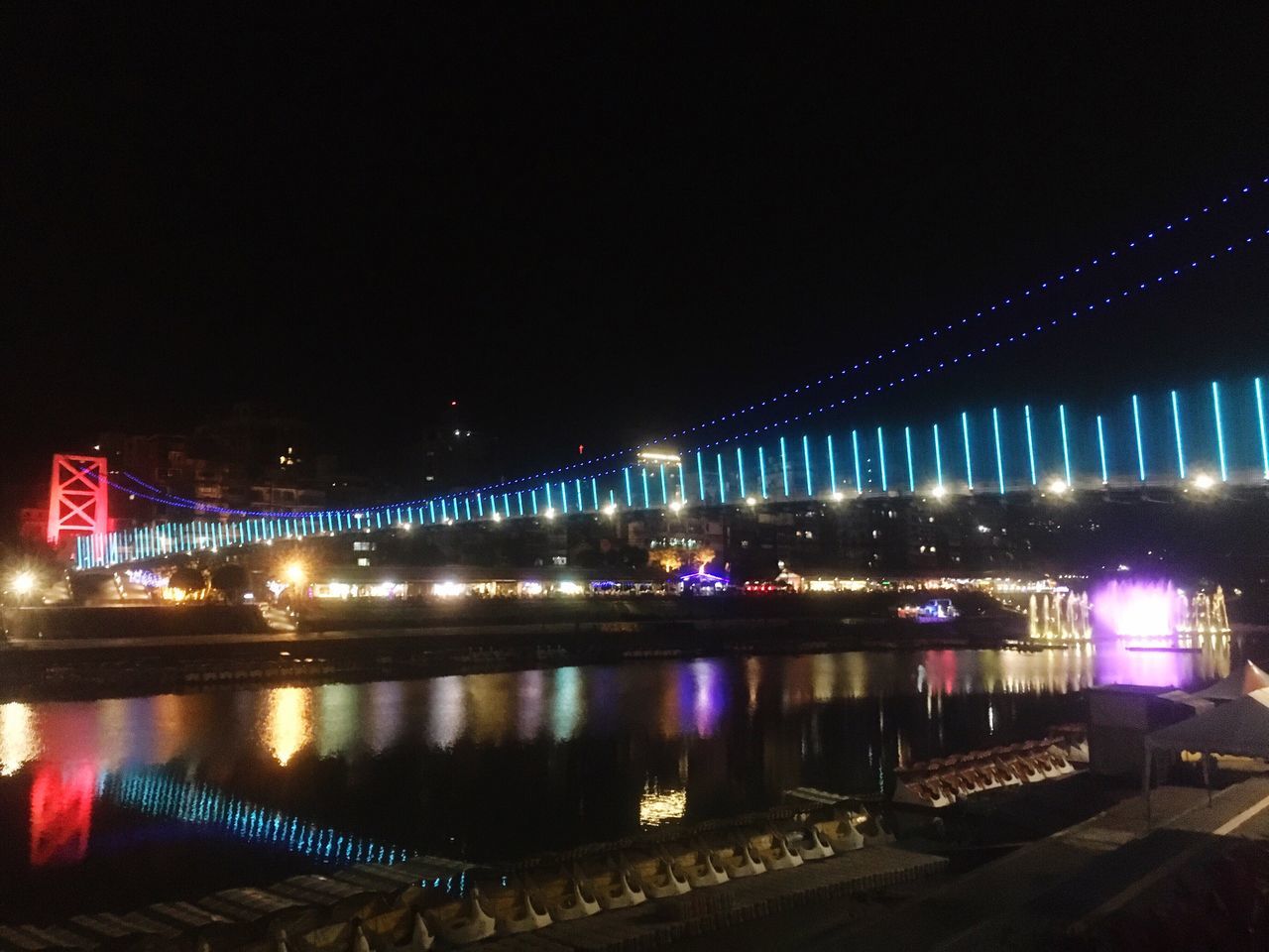 illuminated, night, reflection, water, bridge - man made structure, transportation, river, architecture, sky, built structure, travel destinations, city, building exterior, no people, connection, outdoors, nautical vessel