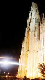 Low angle view of illuminated building at night