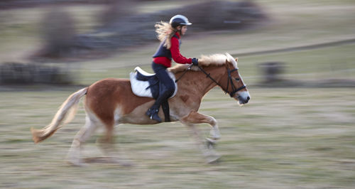 Girl riding horse