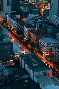 High angle view of city lit up at night