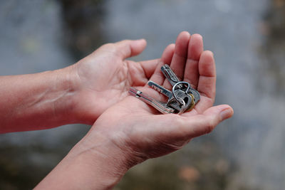 Key in old woman's hand