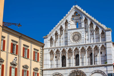 Low angle view of building against blue sky