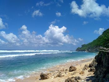 Scenic view of beach against sky
