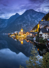 River amidst buildings in city against sky