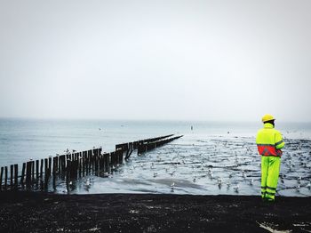Safety man standing at beach