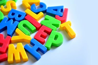 Close-up of colorful toys over white background