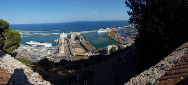 High angle view of buildings and sea against sky