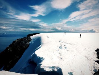 Scenic view of sea against cloudy sky