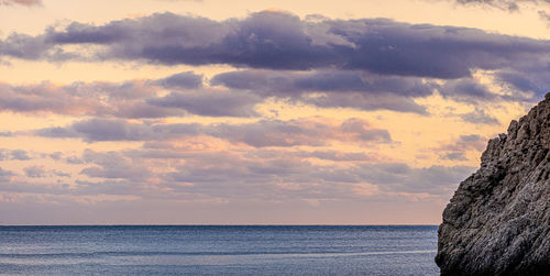 Scenic view of sea against sky at sunset