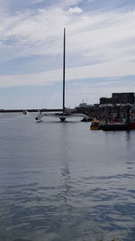 Sailboats on sea against sky